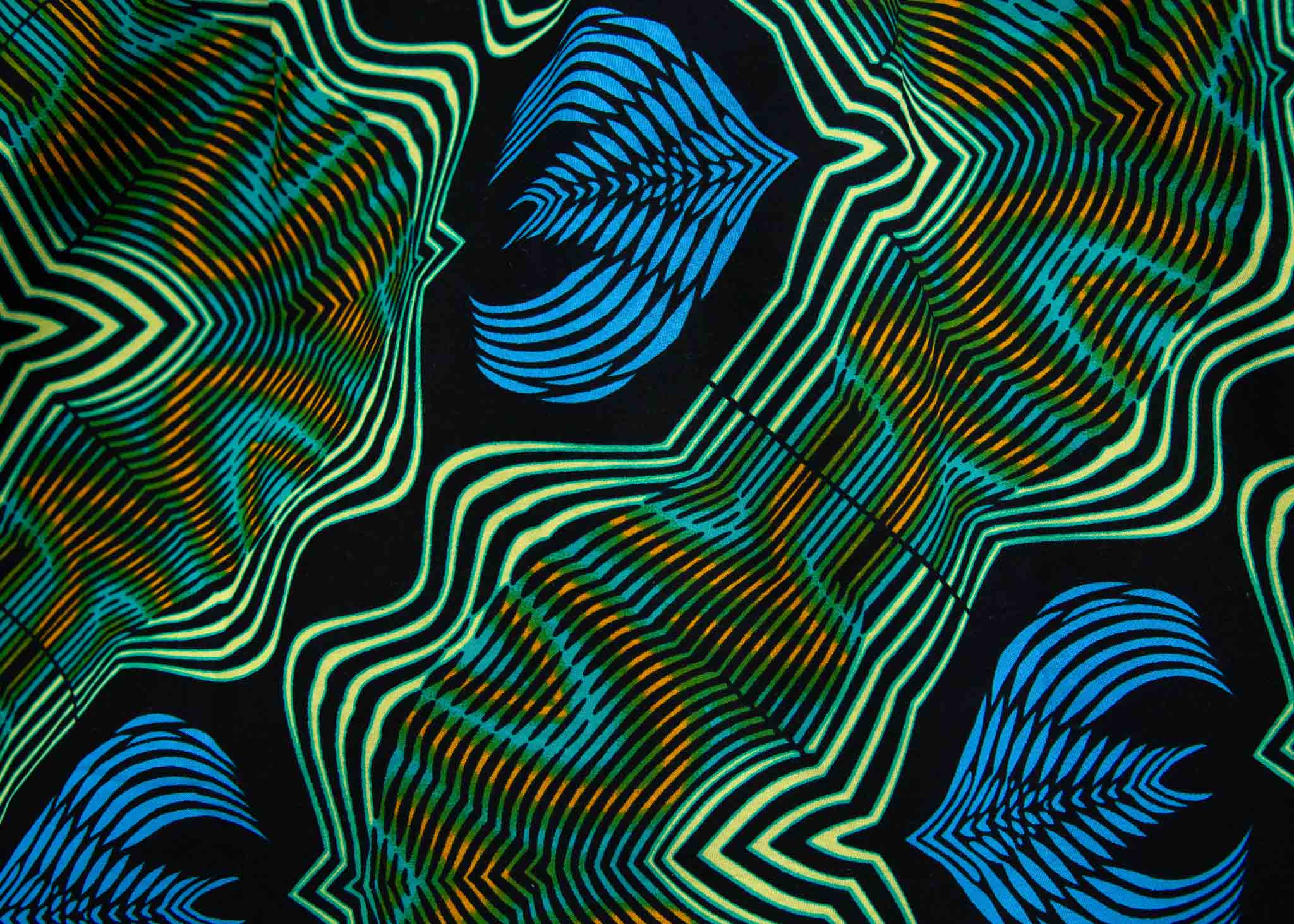 Display of long sleeve blouse with blue and green abstract vibration print.