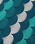 Display of circular grid print dress, with hues of blue.