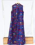 Display of a red and blue graphic print sleeveless dress.