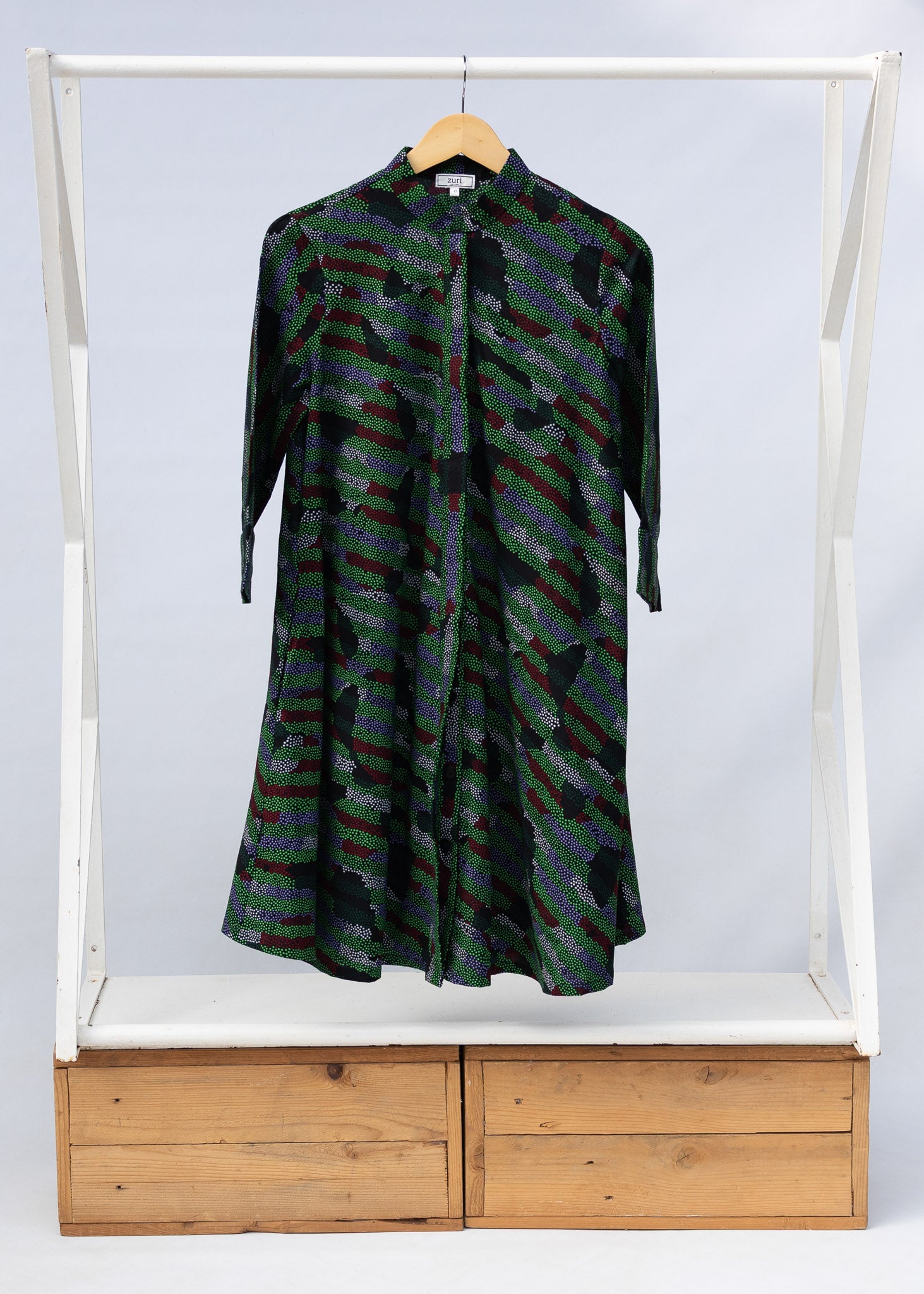 Display of green camo print like dress.