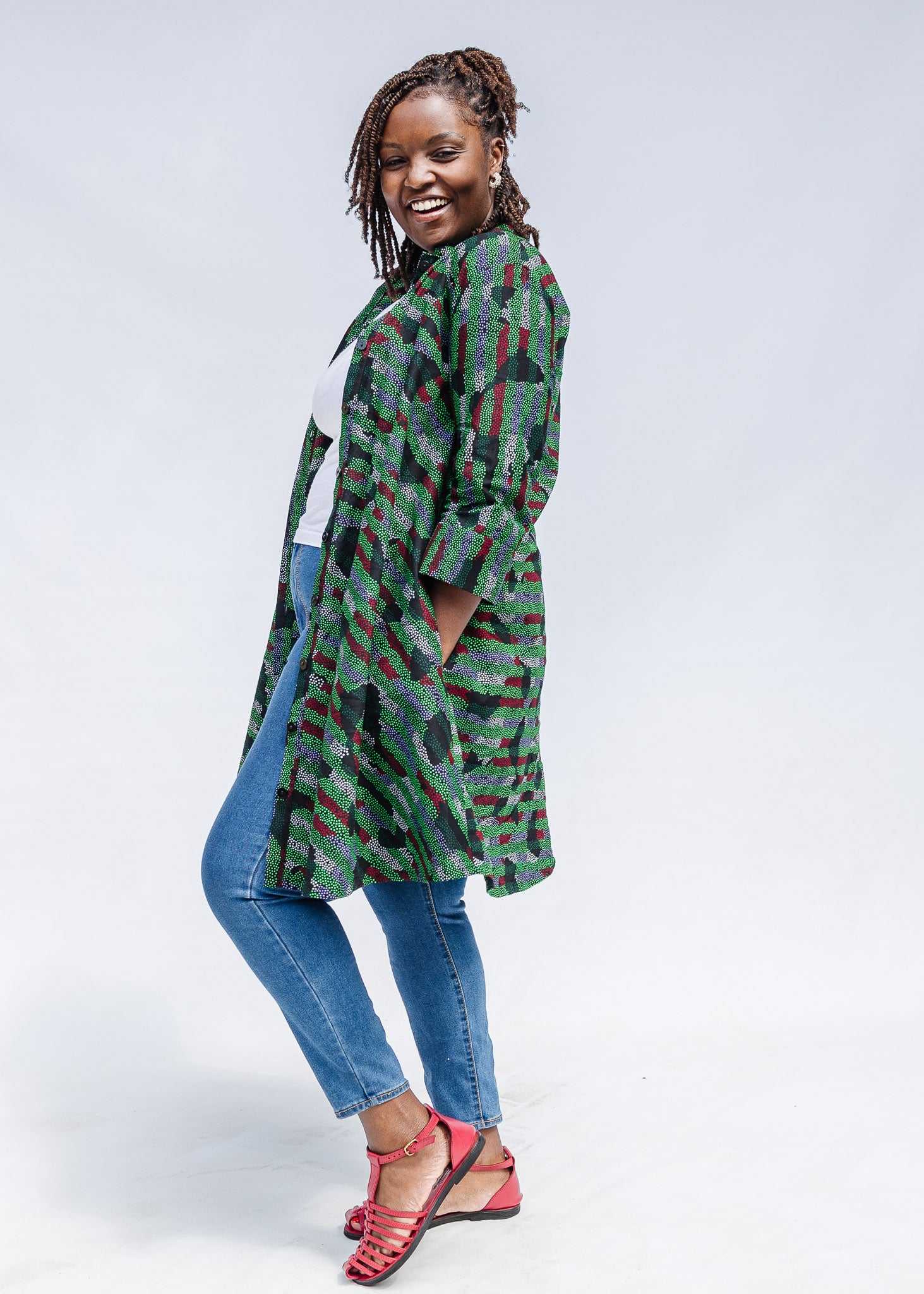 Model wearing green camo print like dress.