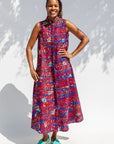 Model wearing a red and blue graphic print sleeveless dress.