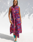 Model wearing a red and blue graphic print sleeveless dress.