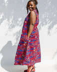 Model wearing a red and blue graphic print sleeveless dress.