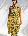 Model wearing yellow and black sleeveless maxi dress.