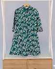 display of a green and white swoosh design dress