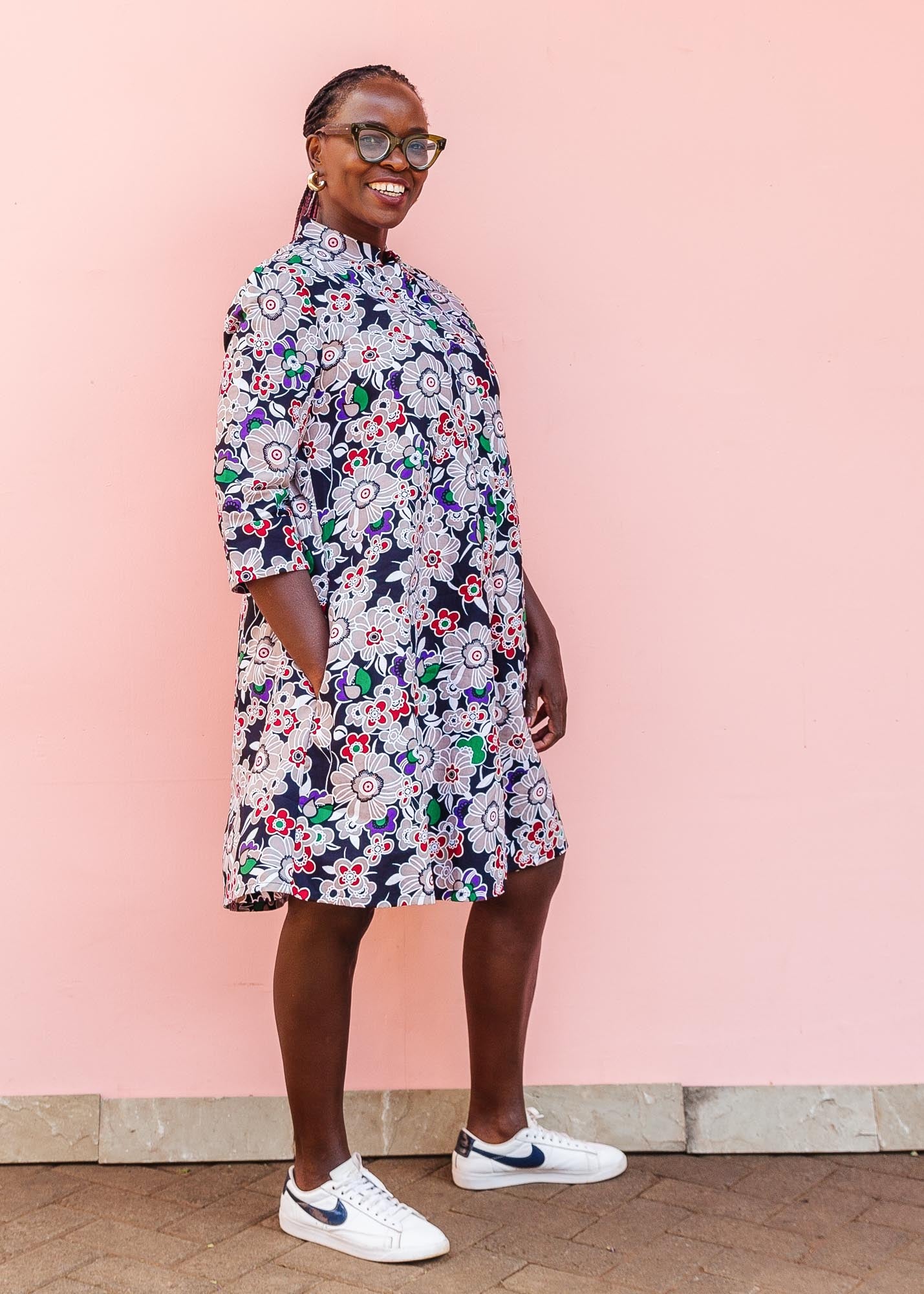 The model is wearing multi-colored floral print