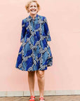 Model wearing blue floral print dress