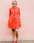 model wearing a red ikat dress