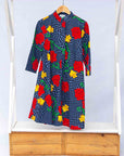 Display of gray and black dress with yellow and red rose print.