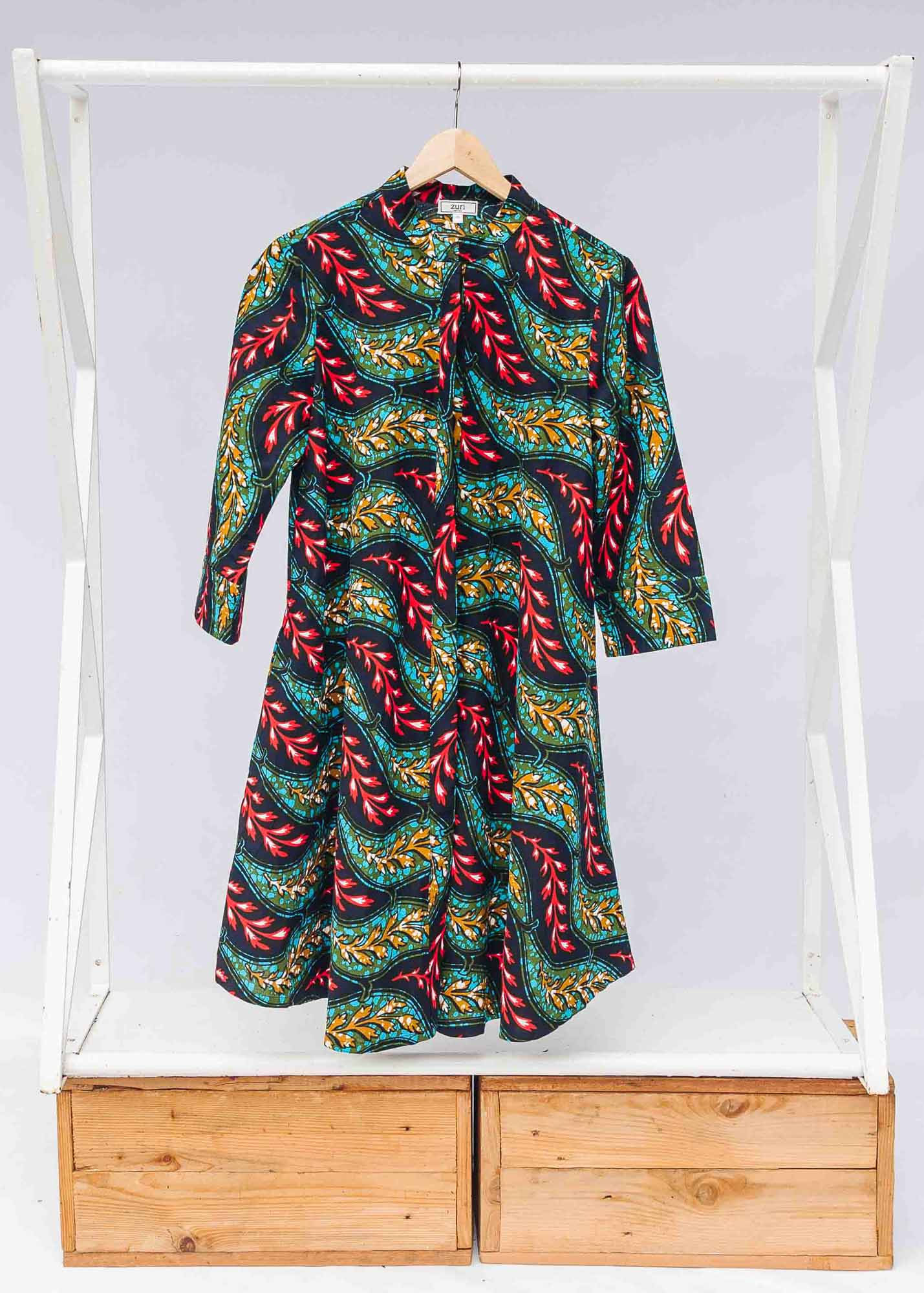 The display of  multicolored leaf print dress