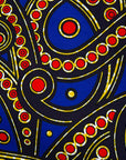 Close up display blue, red, black, yellow and white ornamental print, fabric
