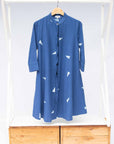 The display of blue sold dress with white triangles