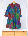 Display of rainbow pixelated print dress. 