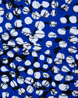 Close up display of blue dress with black and white abstract dots