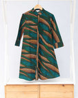 Display of blue, green and orange abstract line dress.