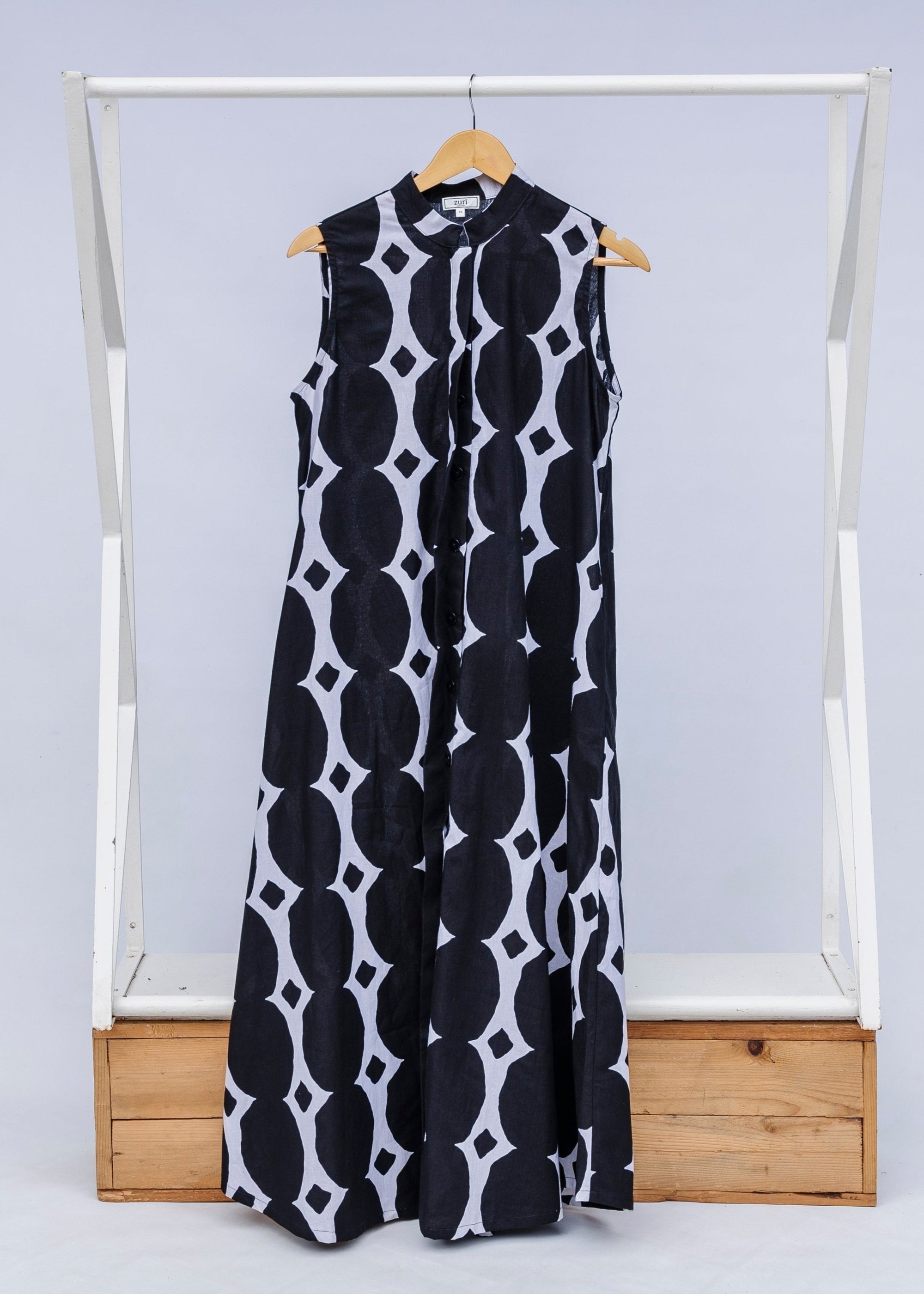 Display of black and white geometric print dress.