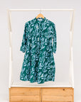 Display of green and blue floral batik dress. 