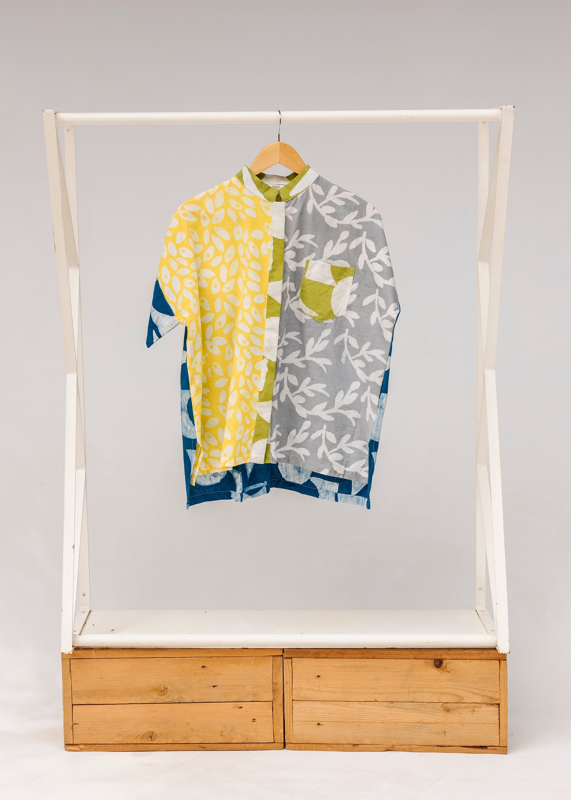 Display of mutlicolored batik shortsleeved shirt.