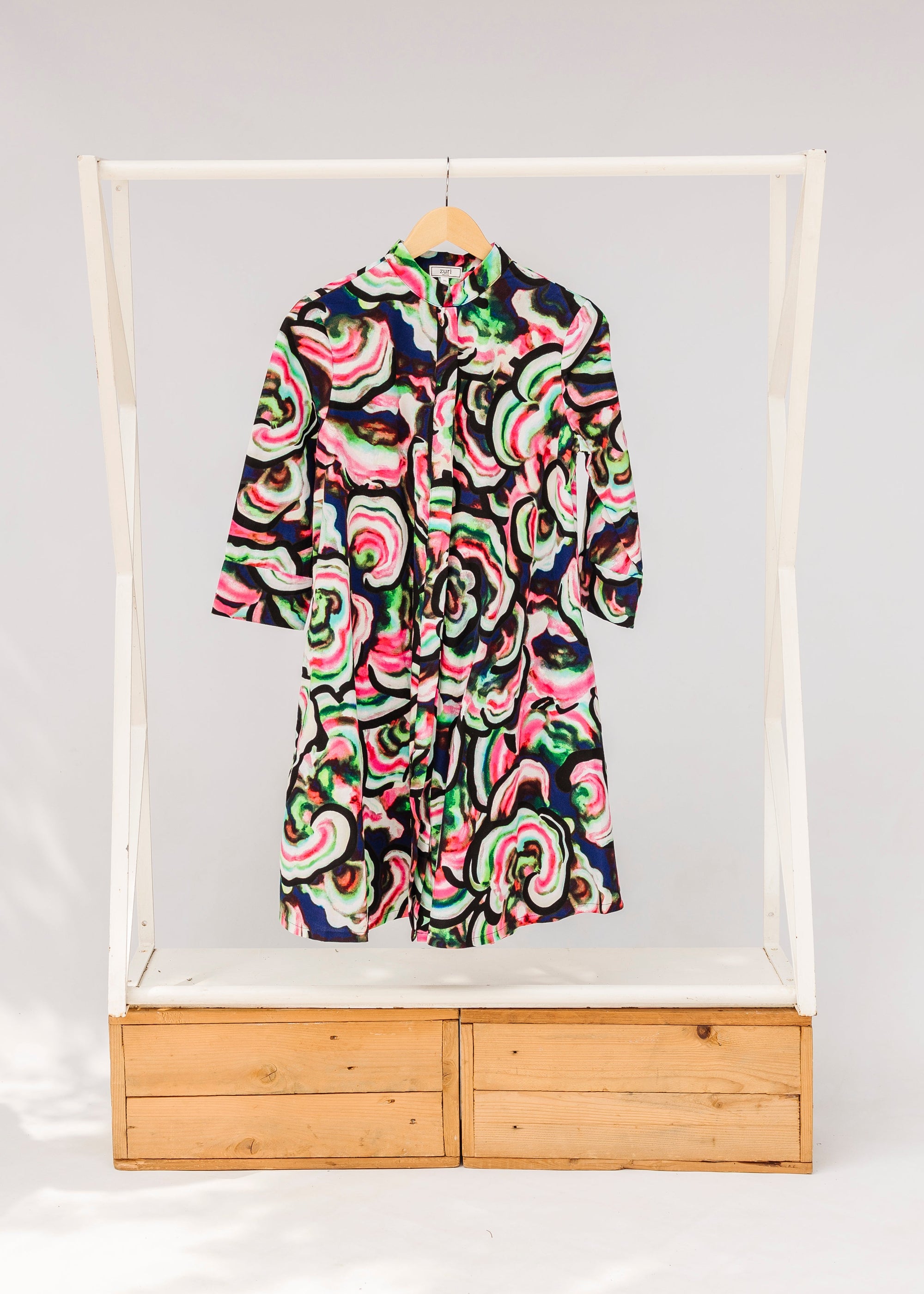 Display of colorful abstract print dress.