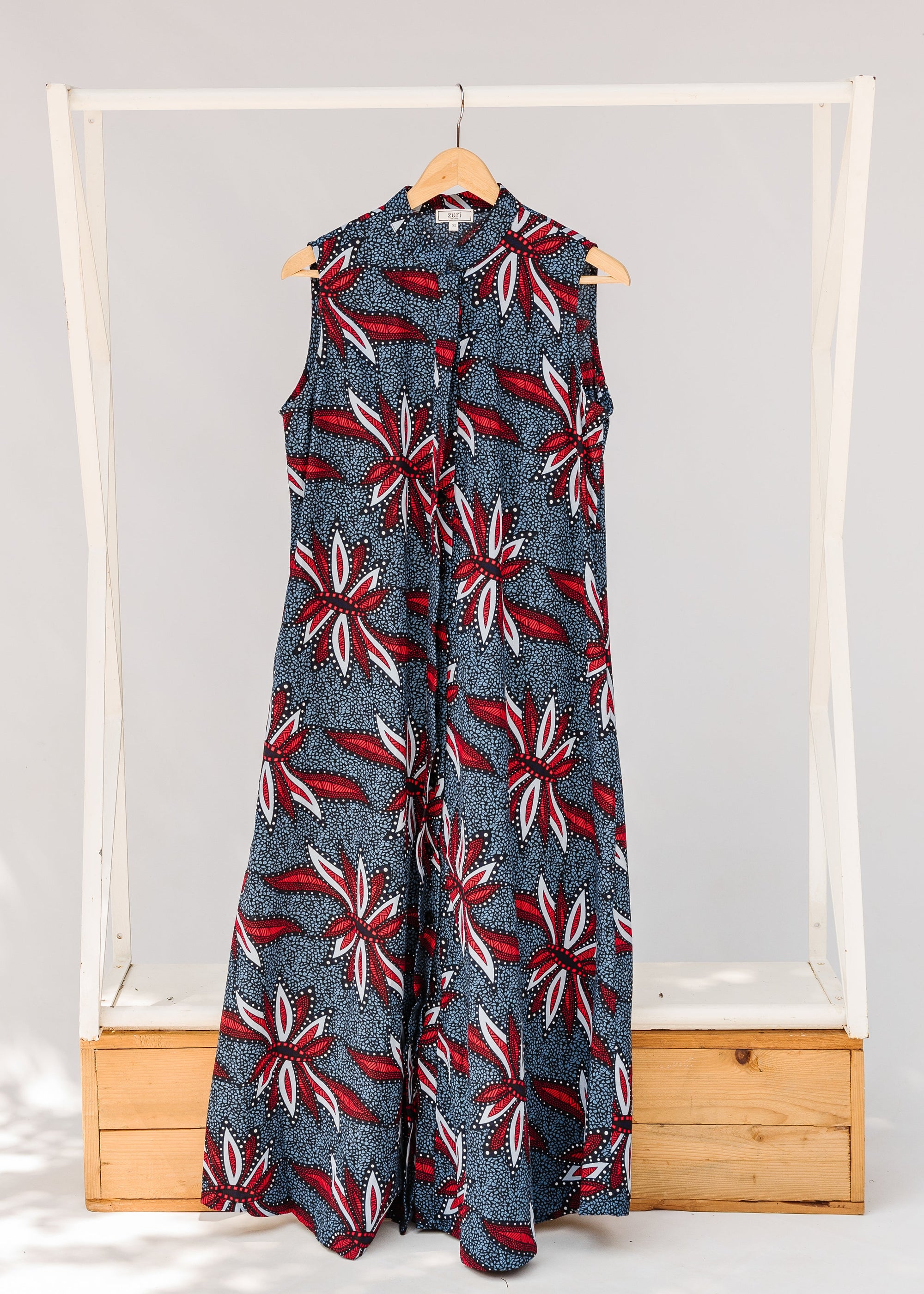 Display of grey, red and black dragonfly print dress.