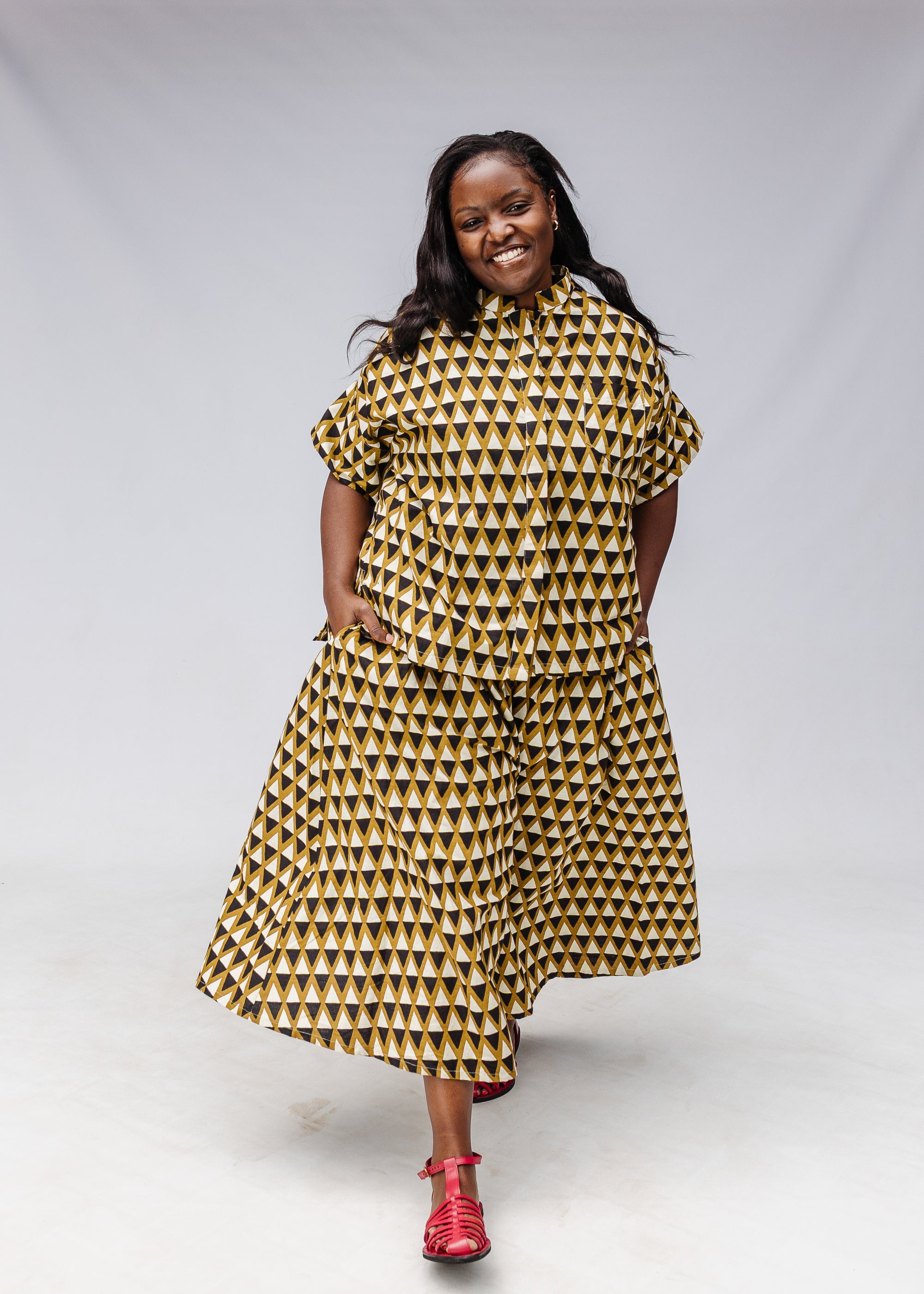 Model wearing black and beige top and matching culotte.