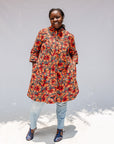 Model wearing butterfly print dress.