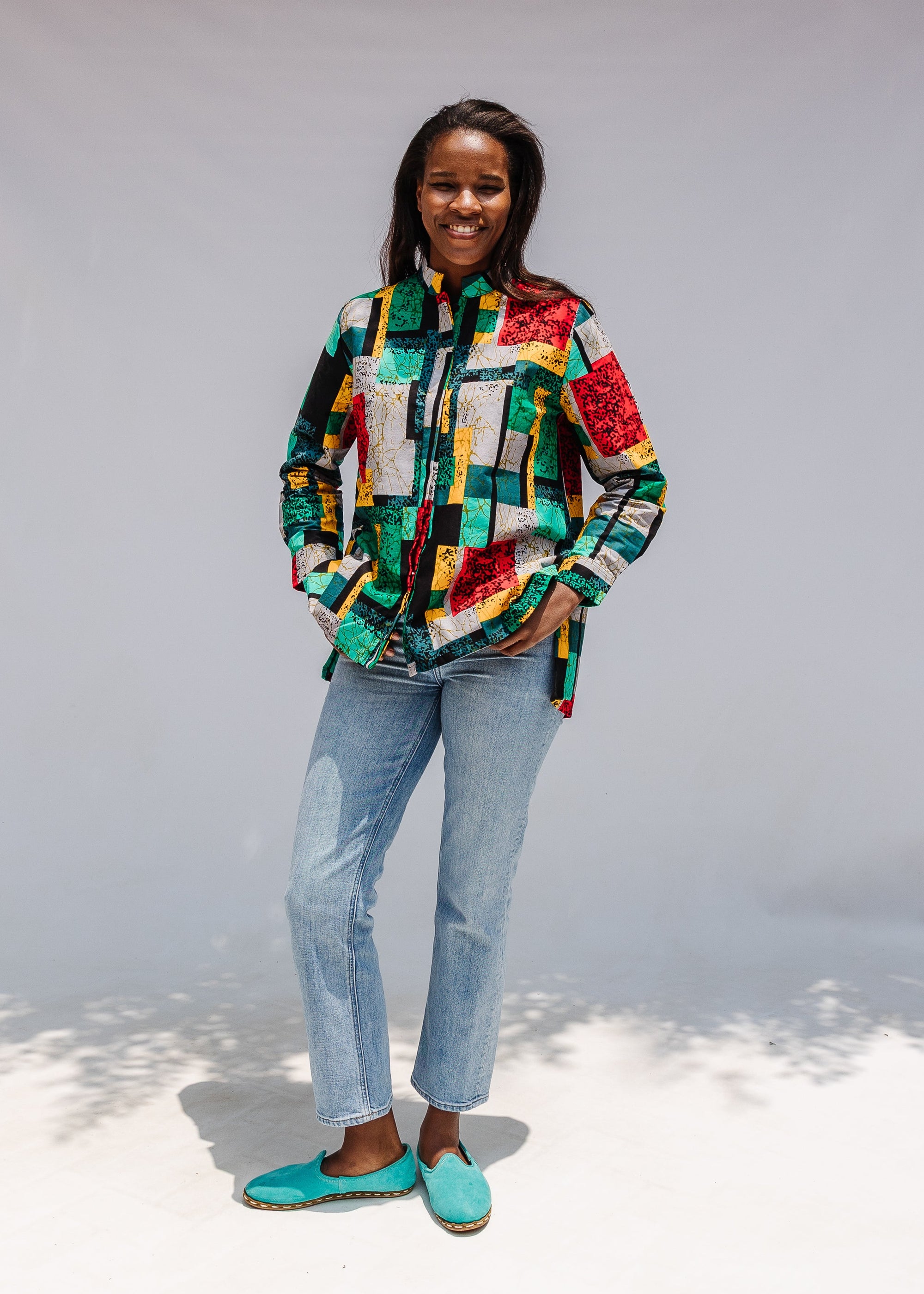 Model wearing mutlicolor abstract print shirt.