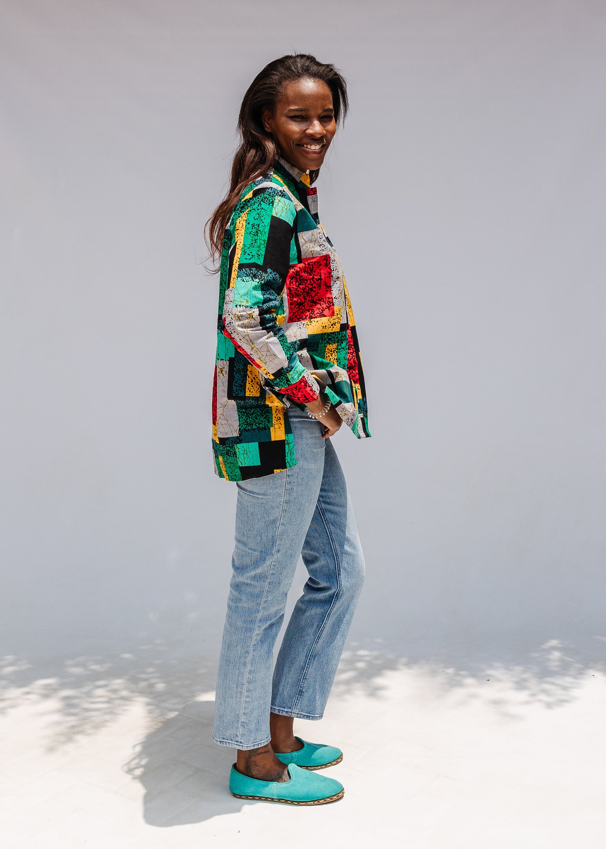 Model wearing mutlicolor abstract print shirt.