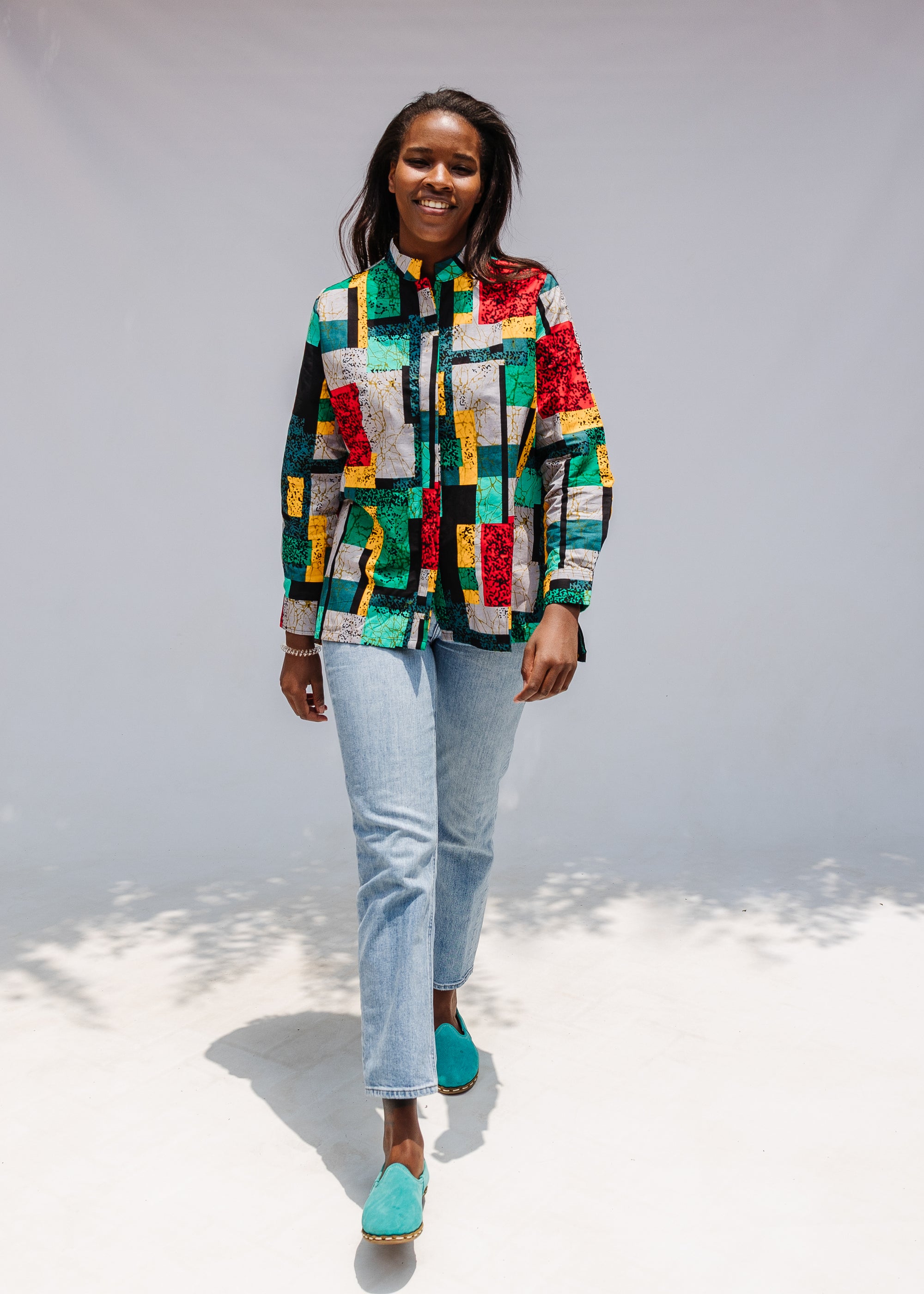 Model wearing mutlicolor abstract print shirt.