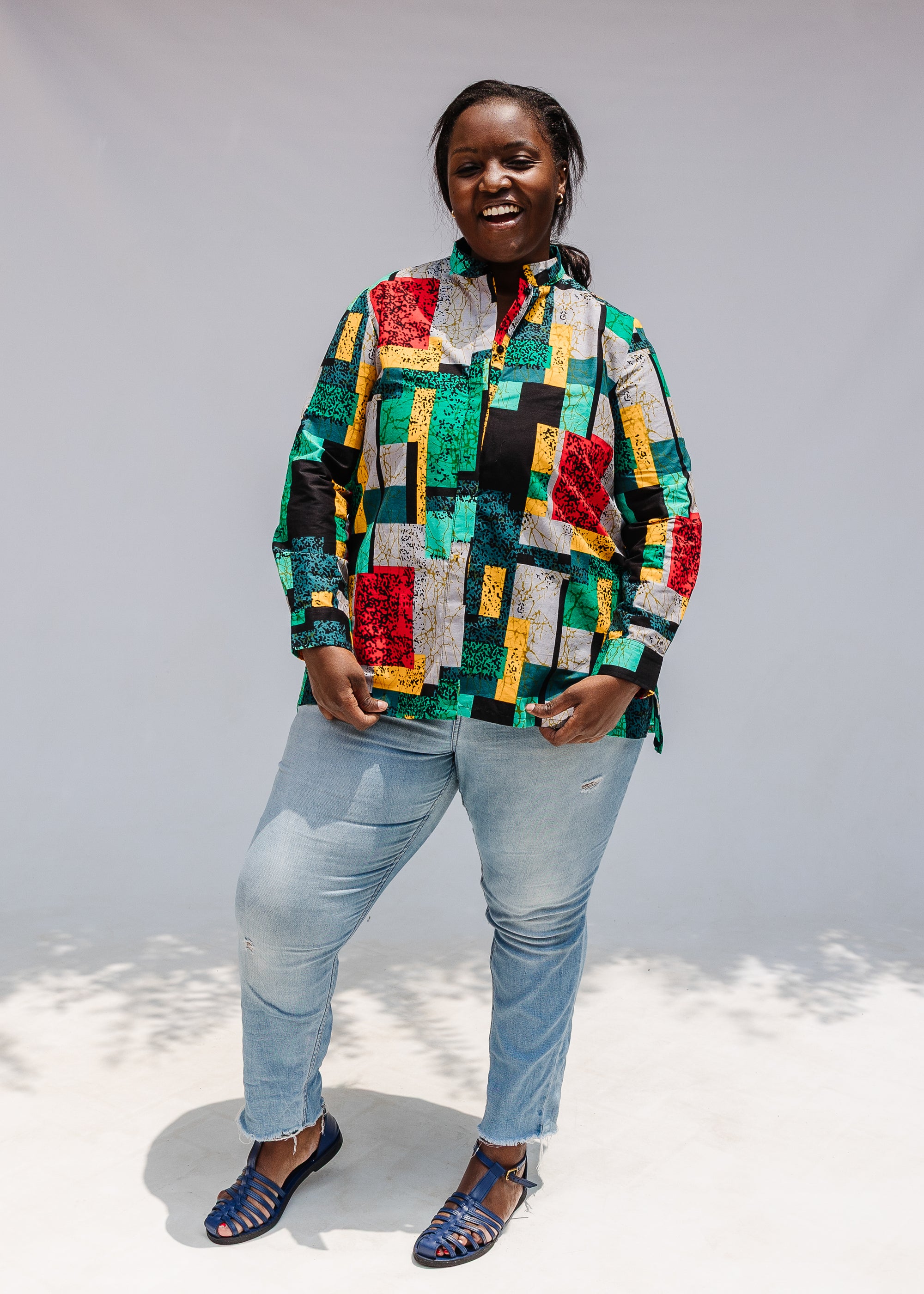 Model wearing mutlicolor abstract print shirt.