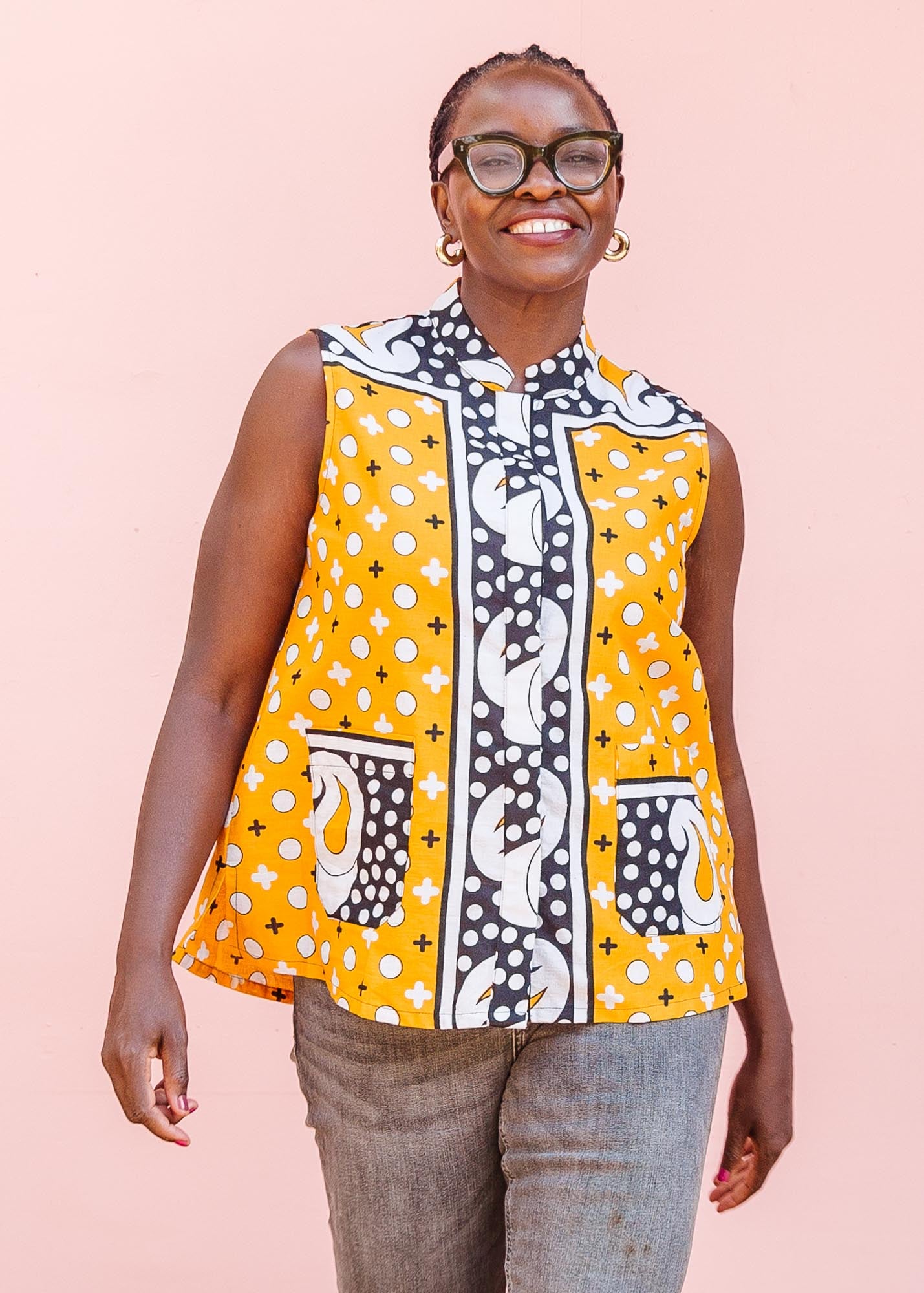 The model is wearing two toned pattern block print tank