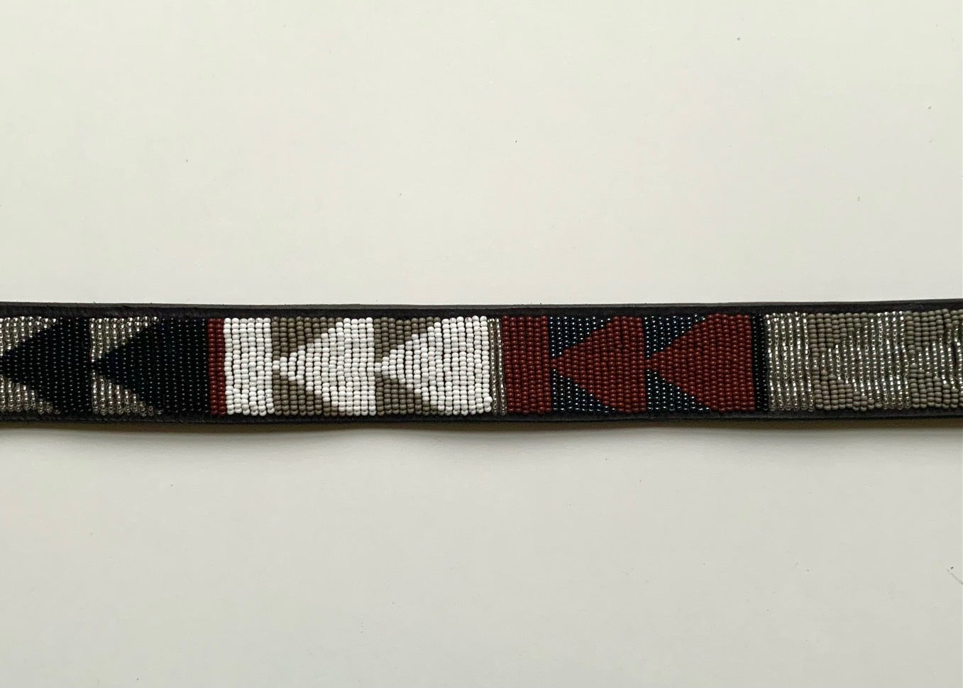 metallic beaded belt with arrow print