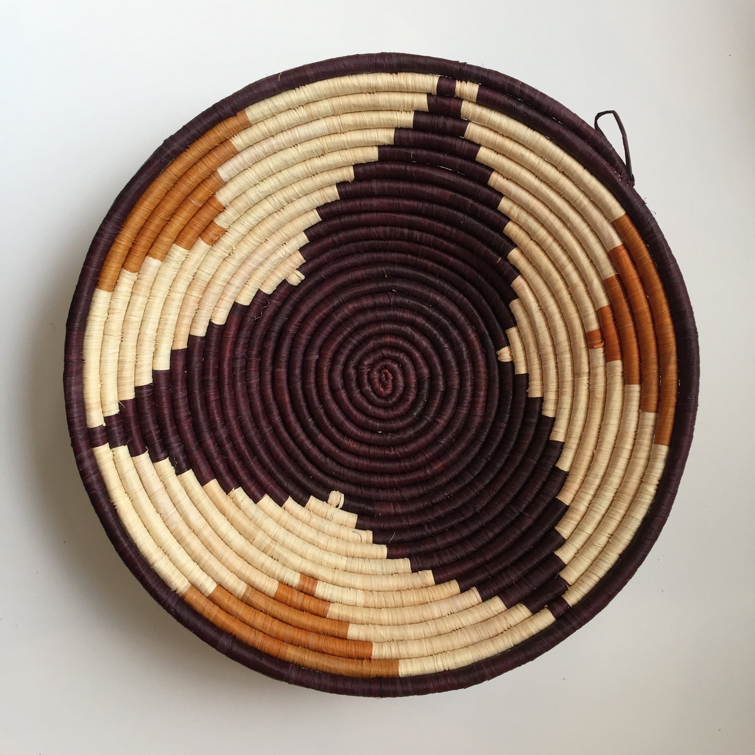 Brown flower design woven bowl