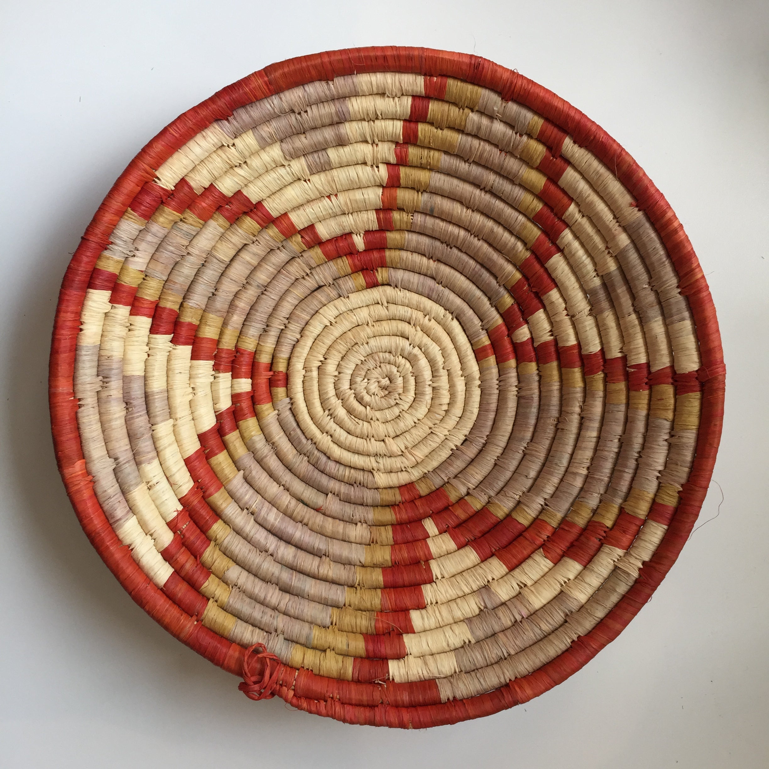 Natural, red and yellow flower design woven bowl