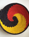 Yellow, red and black swirl woven bowl