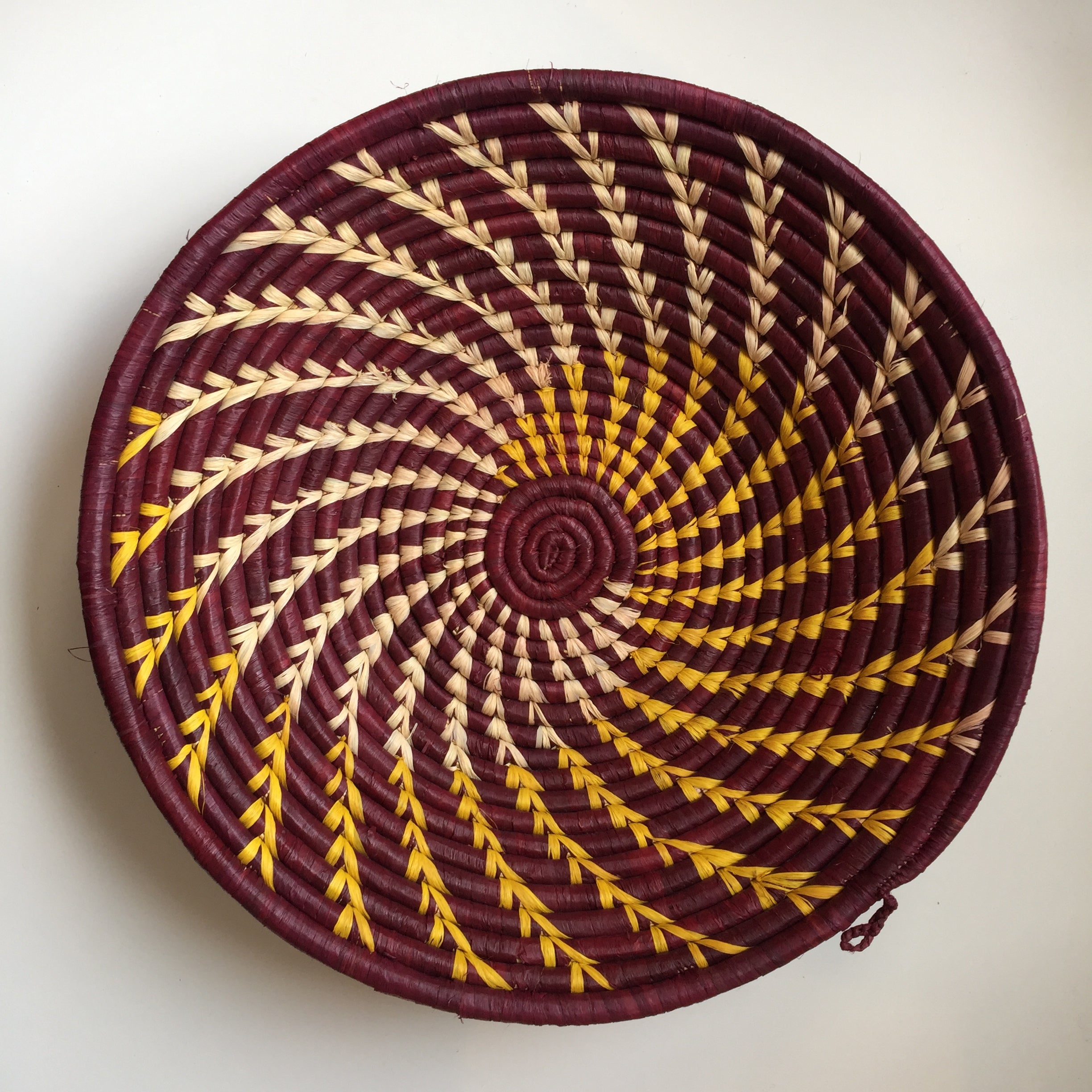Maroon and yellow swirl woven bowls