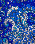 Close up display of paisley blue dress, fabric.
