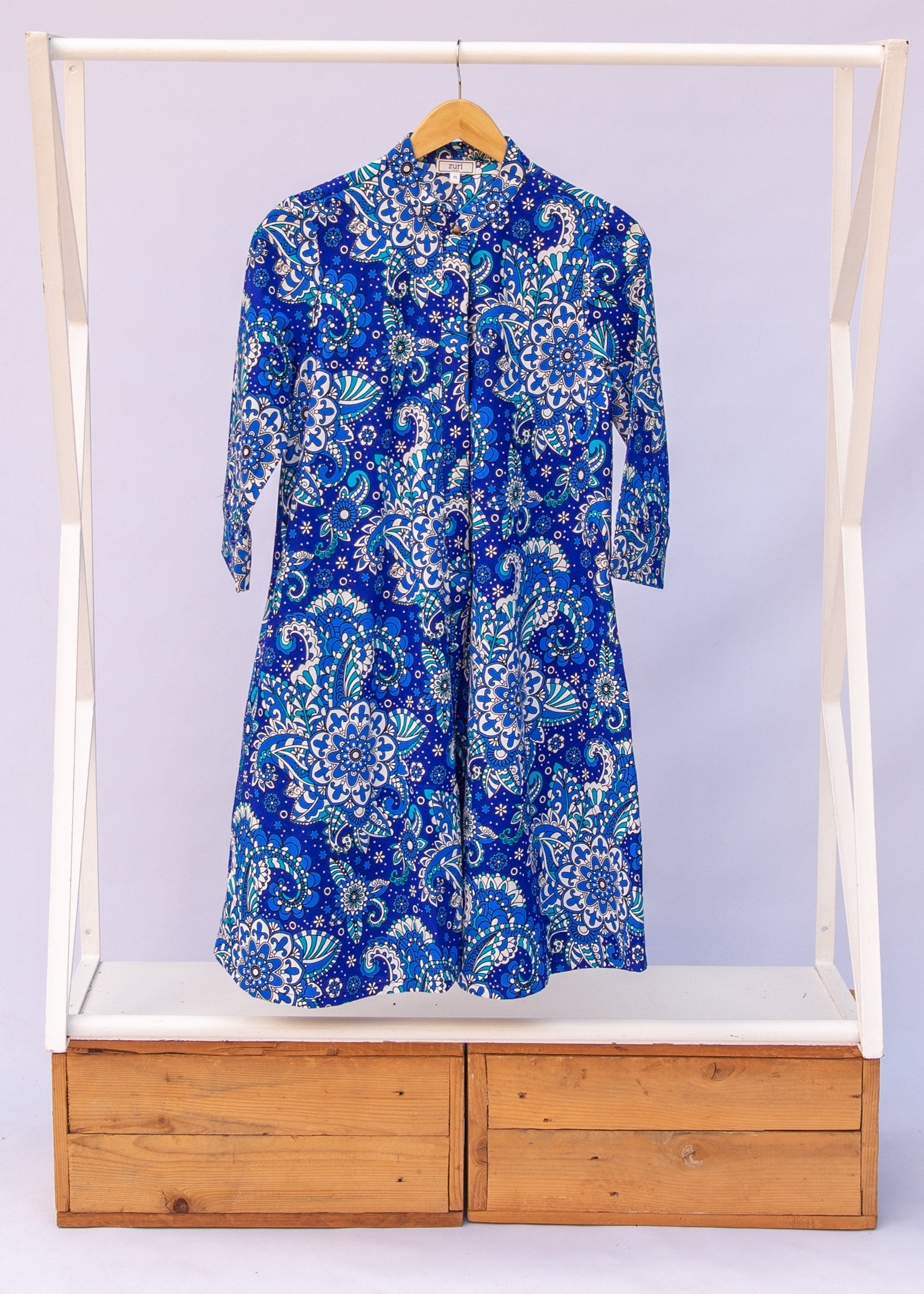 Display of blue paisley dress.