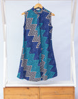 Display of blue, aqua and white zig zag print dress.