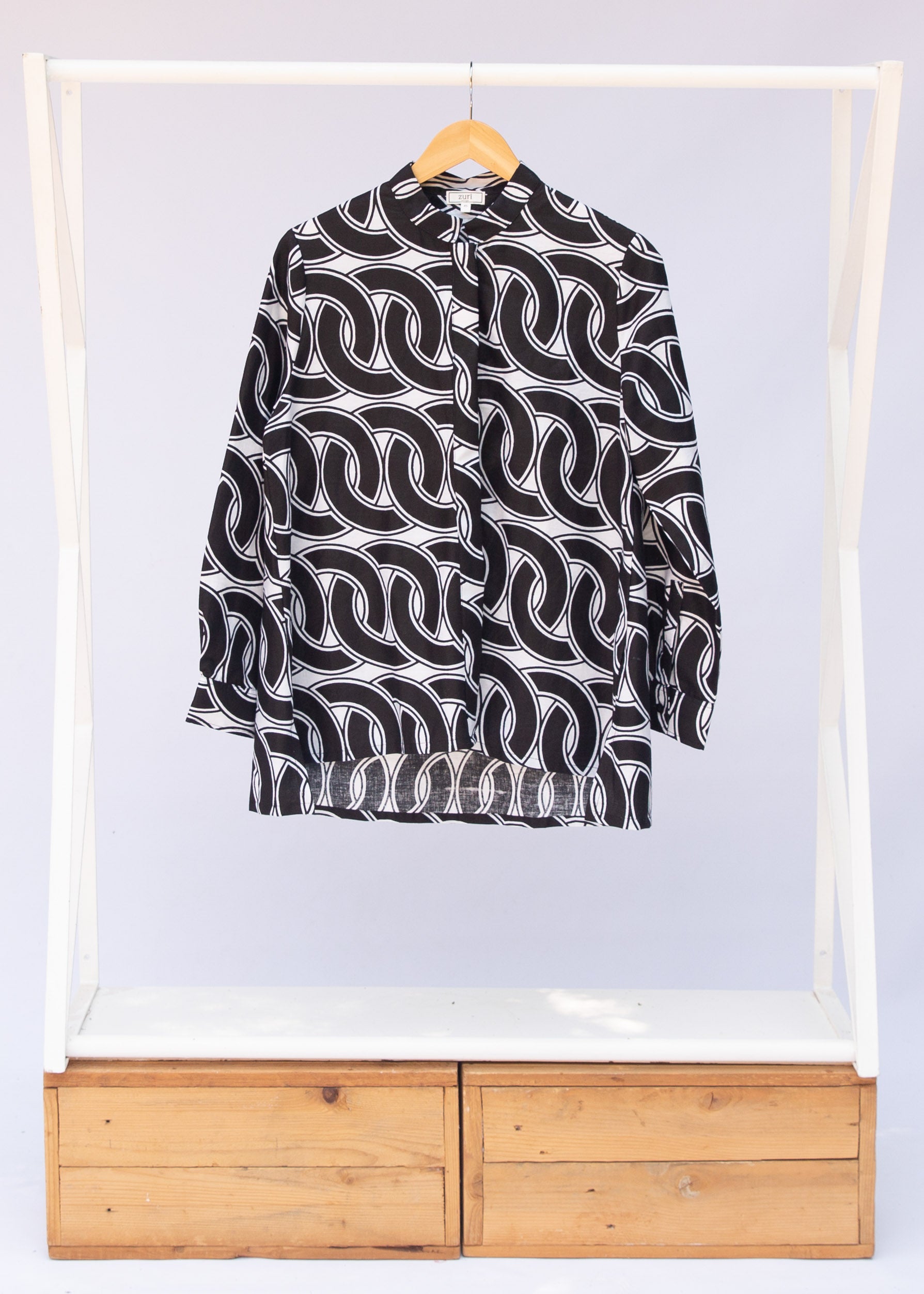 Display of black and white chain link shirt.